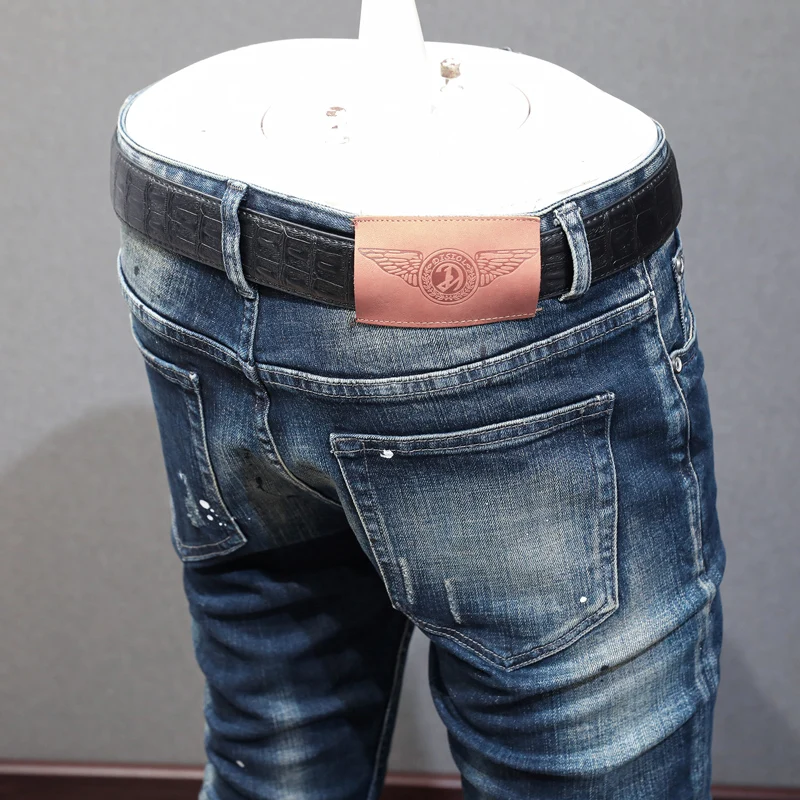 Newly Designer Fashion Men Jeans Retro Black Blue Elastic Slim Fit Painted Ripped Jeans Men Patched Vintage Denim Pants Hombre