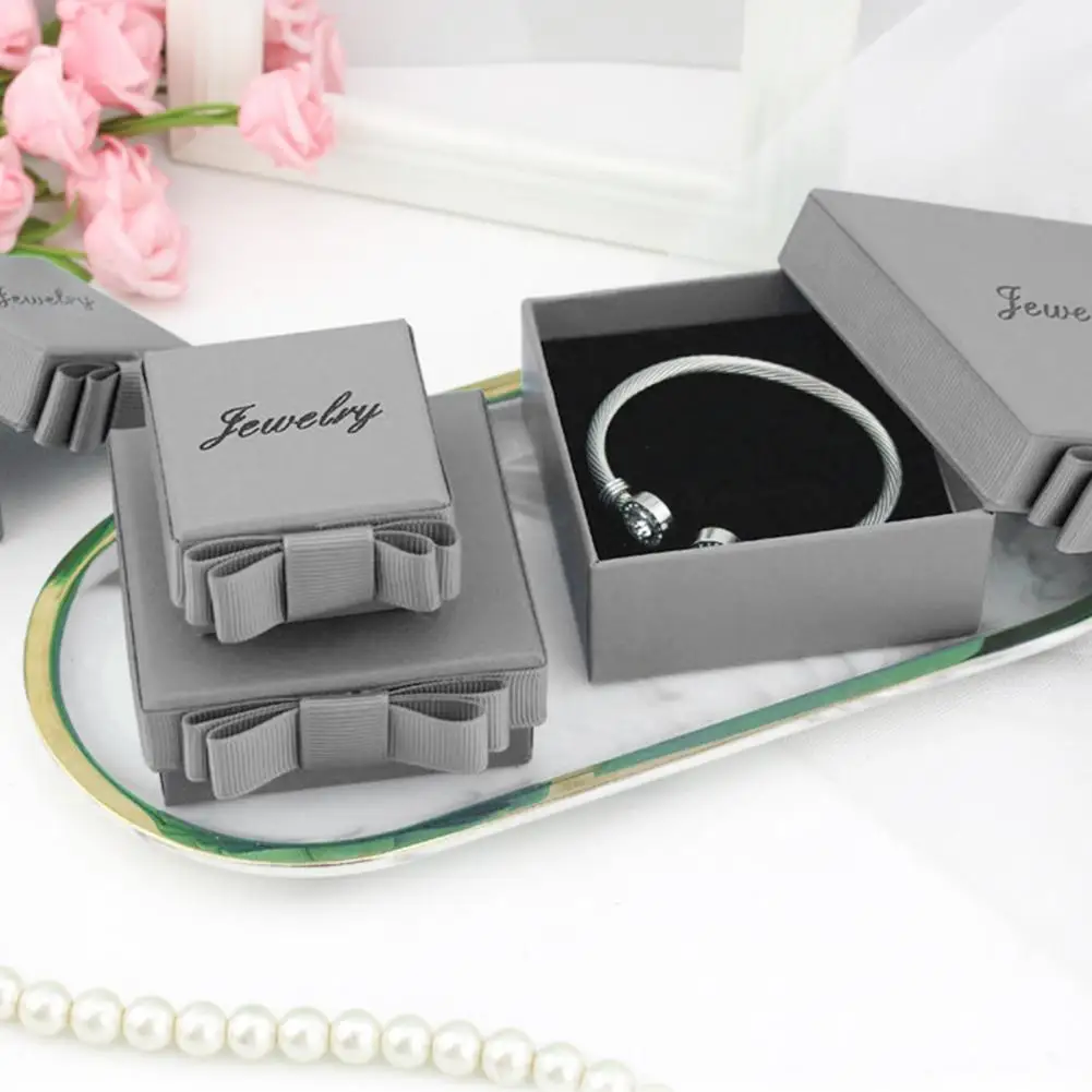 Caja de almacenamiento de joyas con diseño de lazo lateral con tienda de esponja, pulsera de papel, collar, anillo, caja de pendientes, accesorios de joyería