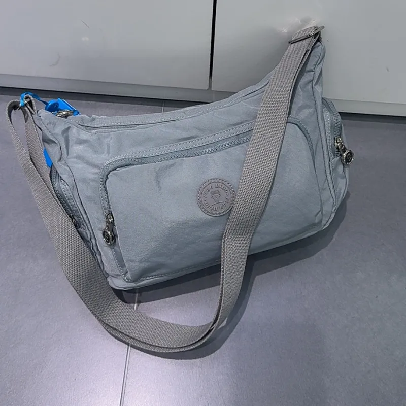 

FIDODIDO 2025 New Women's Bag Crossbody Bag Oxford Cloth Waterproof Multi layer Office Shopping Leisure Versatile Genuine 2546-4