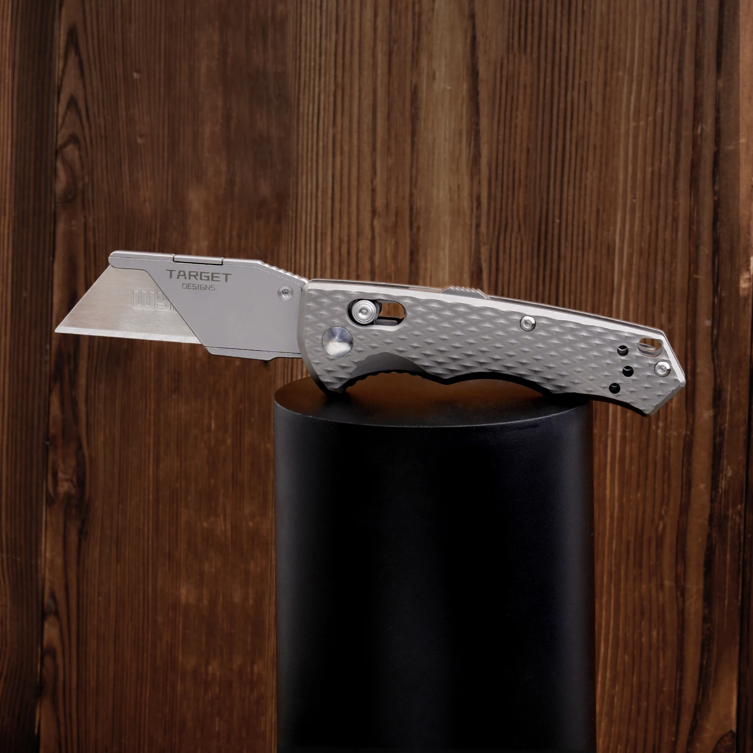 

Titanium multifunctional folding knife. Outdoor pocket tool with pen clip