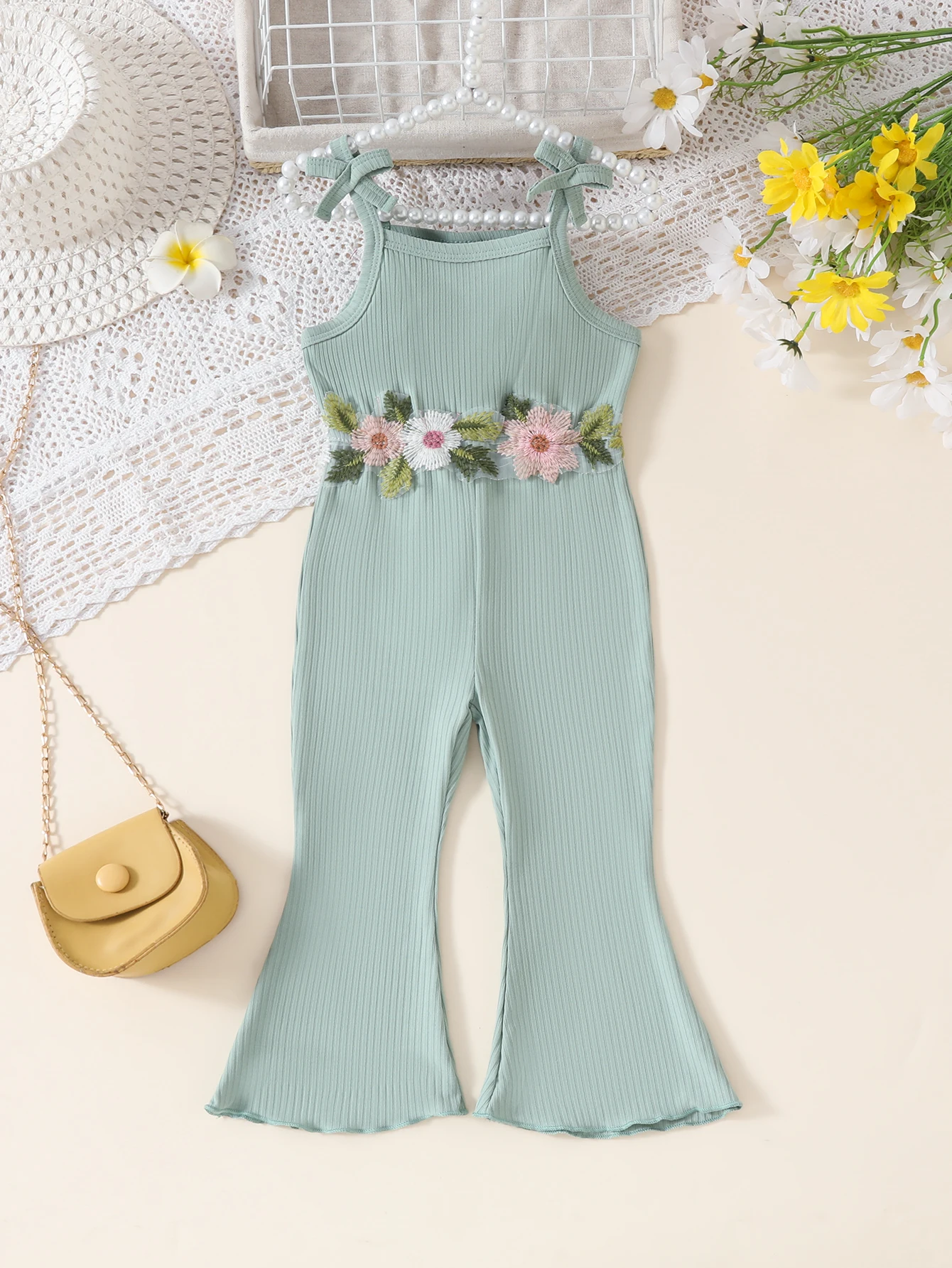Baby girl's floral appliqué decorated halter with bow flared pants romper