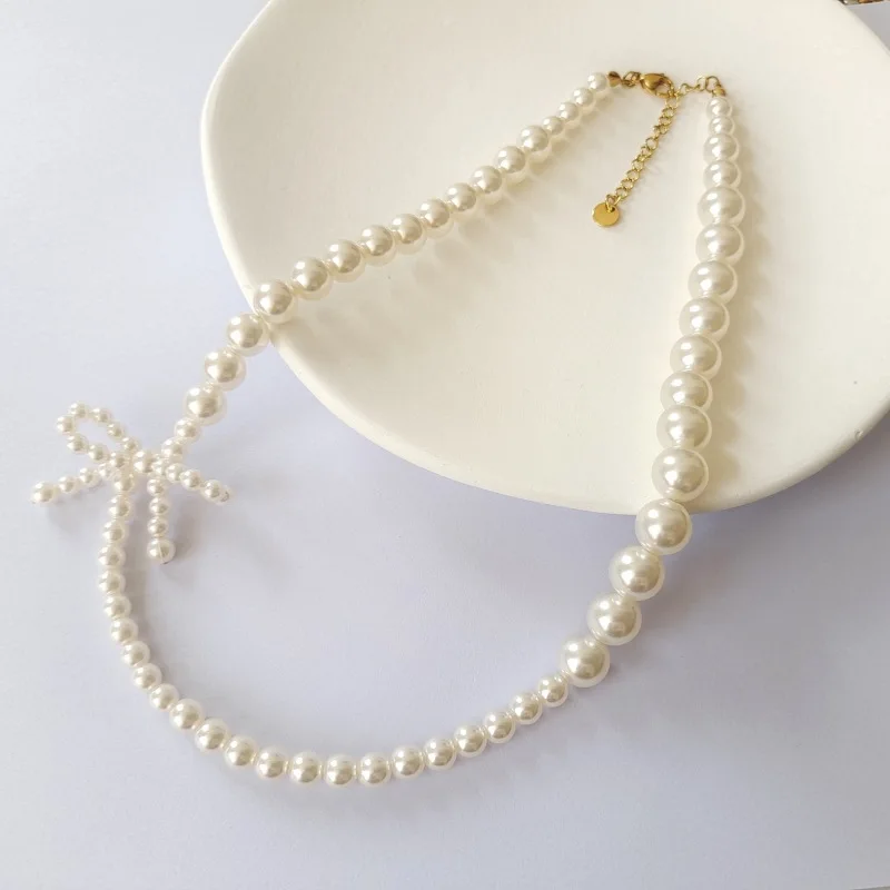 2024 Butterfly Knot Pearl Necklace French Round High Brightness Beaded Sweater Chain High End Feel Bowknot Clavicle Chain Female