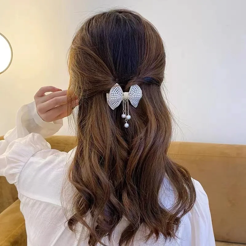 New bow hair clip for women, imitation pearl and rhinestone spring clip, light luxury high-end style hair accessory view 2