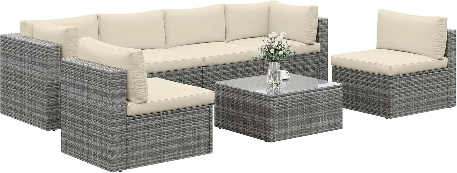 

Комплект садовой мебели из 7 предметов: всепогодный диван из искусственного ротанга с прозрачным стеклянным столиком, съемными бежевыми подушками, коричневый ротанг