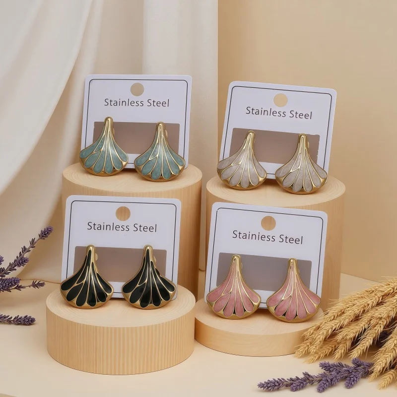 Purchase the charming ginkgo leaf geometric fan-shaped stainless steel earrings, stud earrings, gold fashionable design, retro e