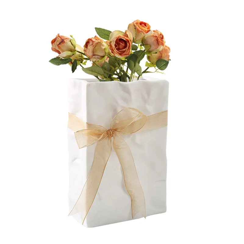 

High aesthetic paper bag, ceramic vase, fresh flowers, water nourishing tabletop, living room, home decoration