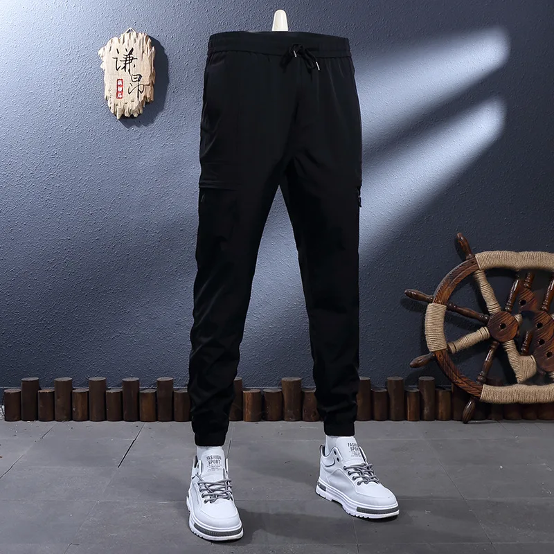 

Летние тонкие черные дышащие эластичные облегающие повседневные брюки из ледяного шелка для мужчин, корейская версия, модные быстросохнущие спортивные брюки