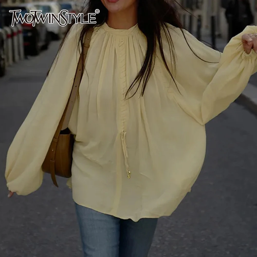 

TWOTWINSTYLE Solid Loose Temperament Blouse for Women Stand Collar Lantern Sleeve Patchwork Lace Up Blouses Female Spring Style