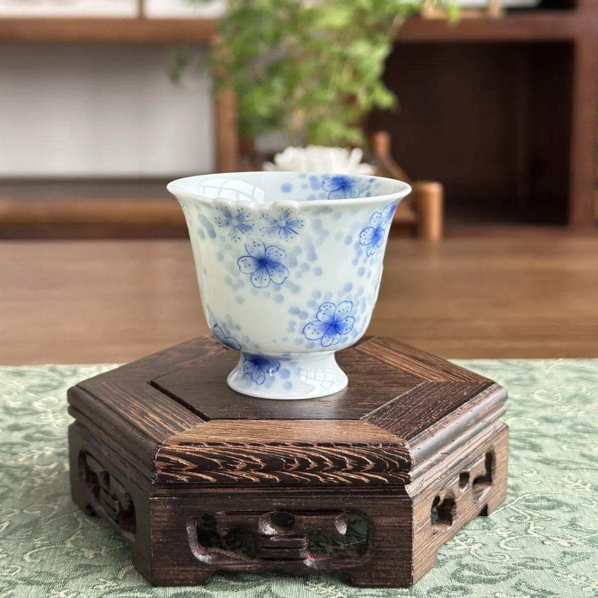 Blue and white ceramic carving plum blossom pattern high foot skimming cup Jingdezhen