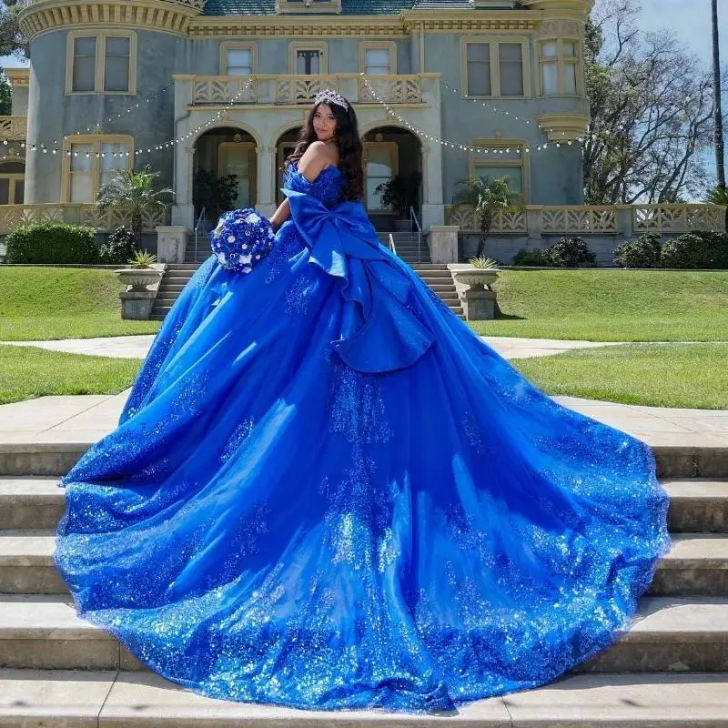 2025 Glitter Sequined ROYAL BLUE Ball Gown Quinceanera เดรสโบว์พรหมชุดผู้หญิง Vestidos De Festa ที่กําหนดเอง