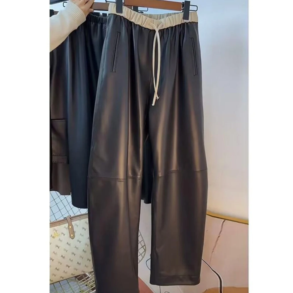 

Korean style black leather pants women's autumn and winter new high-end splicing loose straight tube Haren warm casual pants