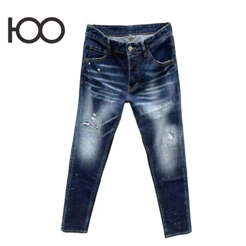 

100 C092 Men's denim pants – washed to a rugged vintage finish, with raw-ripped holes and bold paint stamps, cut in a sharp sli