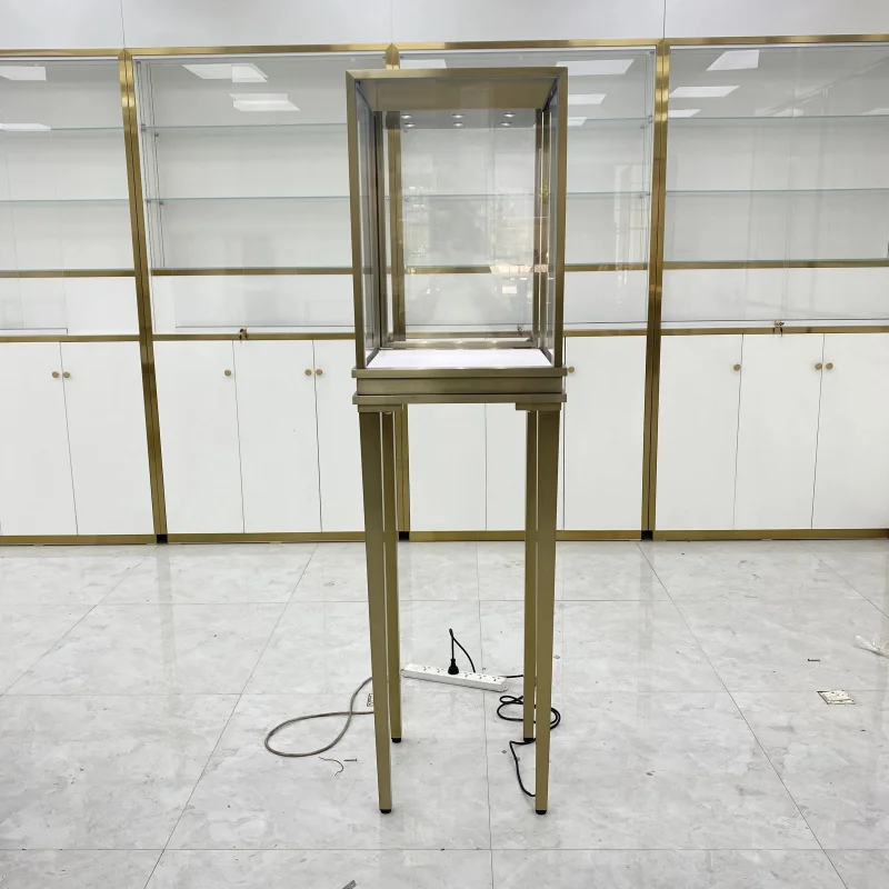 

Customize.Custom Stylish Stand - Alone Jewelry Display Cabinet in Gold and Glass Construction Jewelry showcase