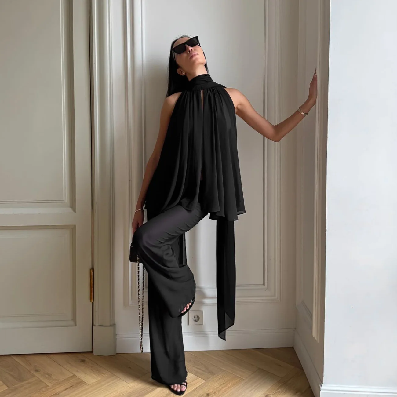 

Black women's two-piece casual fashion set, sleeveless halter crop top with draped wide-leg pants