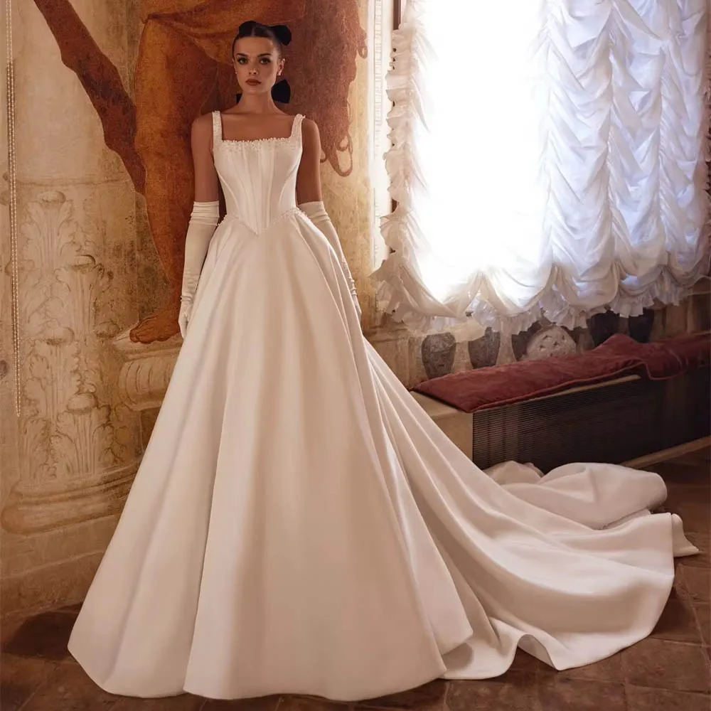 

Мягкое белое атласное свадебное платье по индивидуальному заказу, торжественное свадебное платье без рукавов с квадратным воротником, мечтательное трапециевидное платье со шлейфом