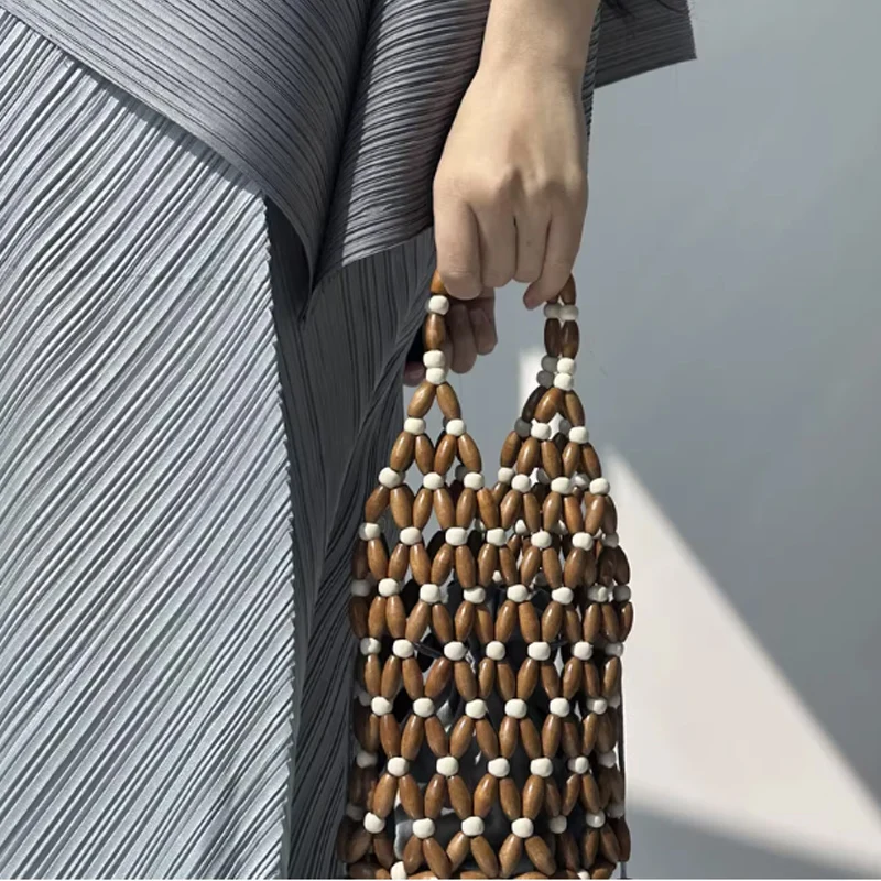 

Fashiona Hand Woven Bead Bucket Bag 2026 New Hollow Wooden Bead Woven Handbag Small Women Bag