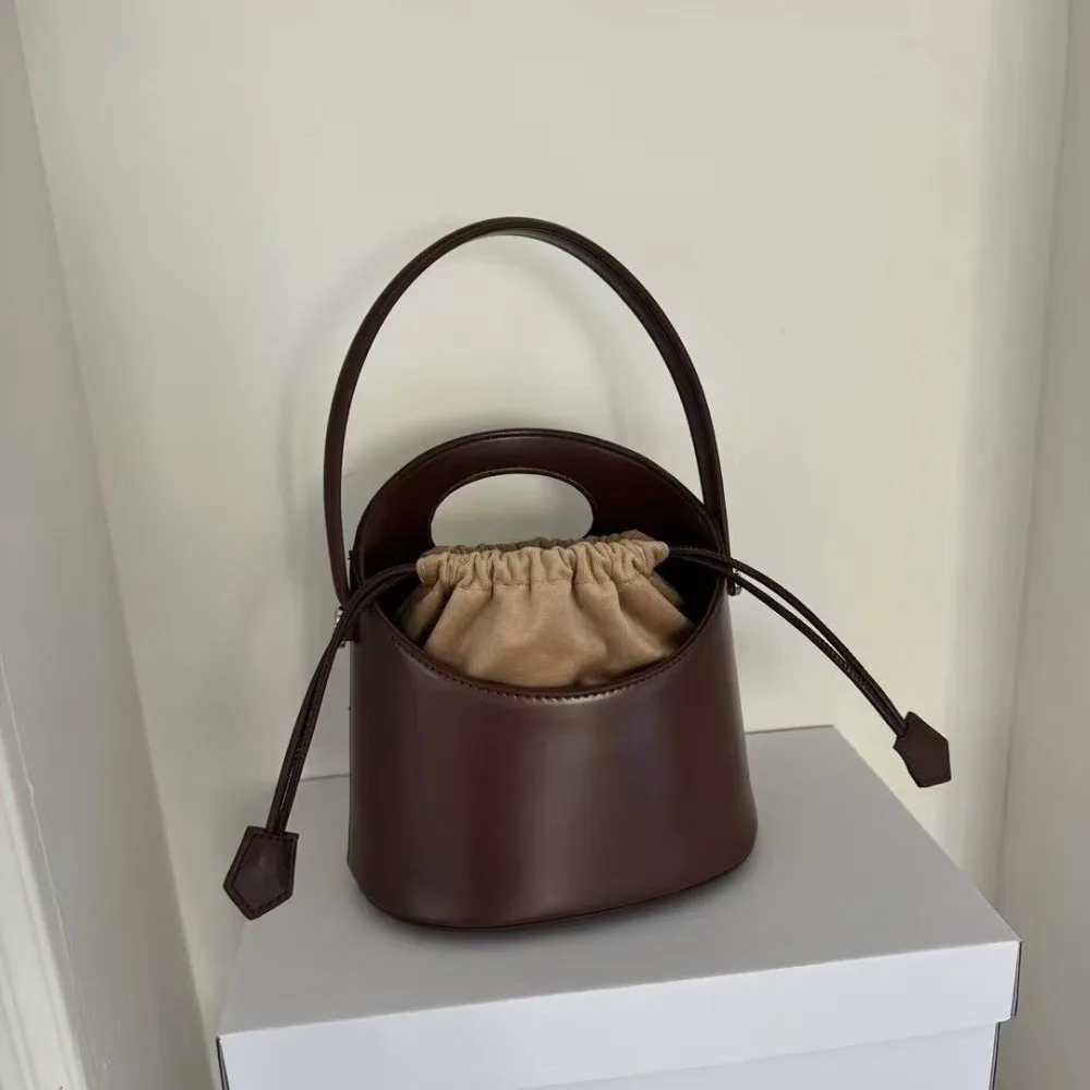 

2026 New Leather Bucket Bag Women's Drawstring Portable Dual-purpose Bag Crossbody Shoulder Texture Unique Fashion Simple