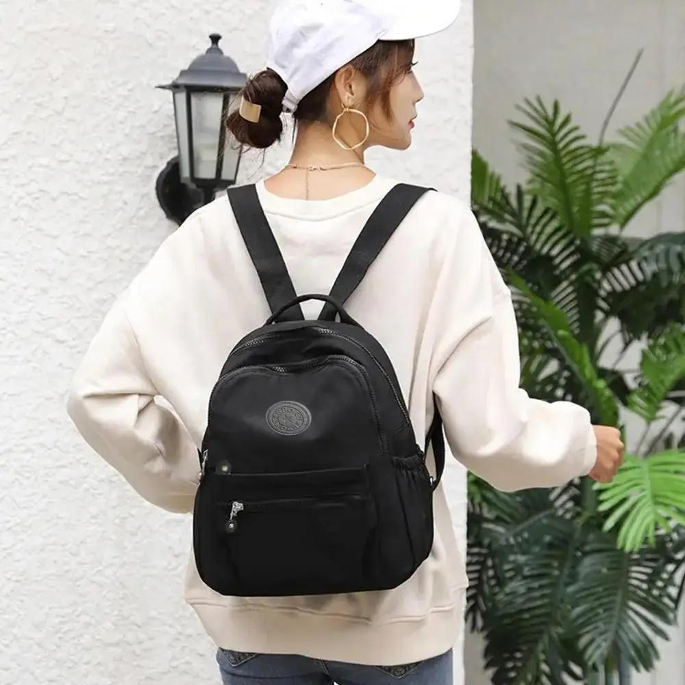 Casual กระเป๋าสะพายไหล่ความจุขนาดใหญ่กันน้ําน้ําหนักเบา Mini Rucksack สวมใส่กระเป๋าเป้สะพายหลังขนาดเล็กโรงเรียน