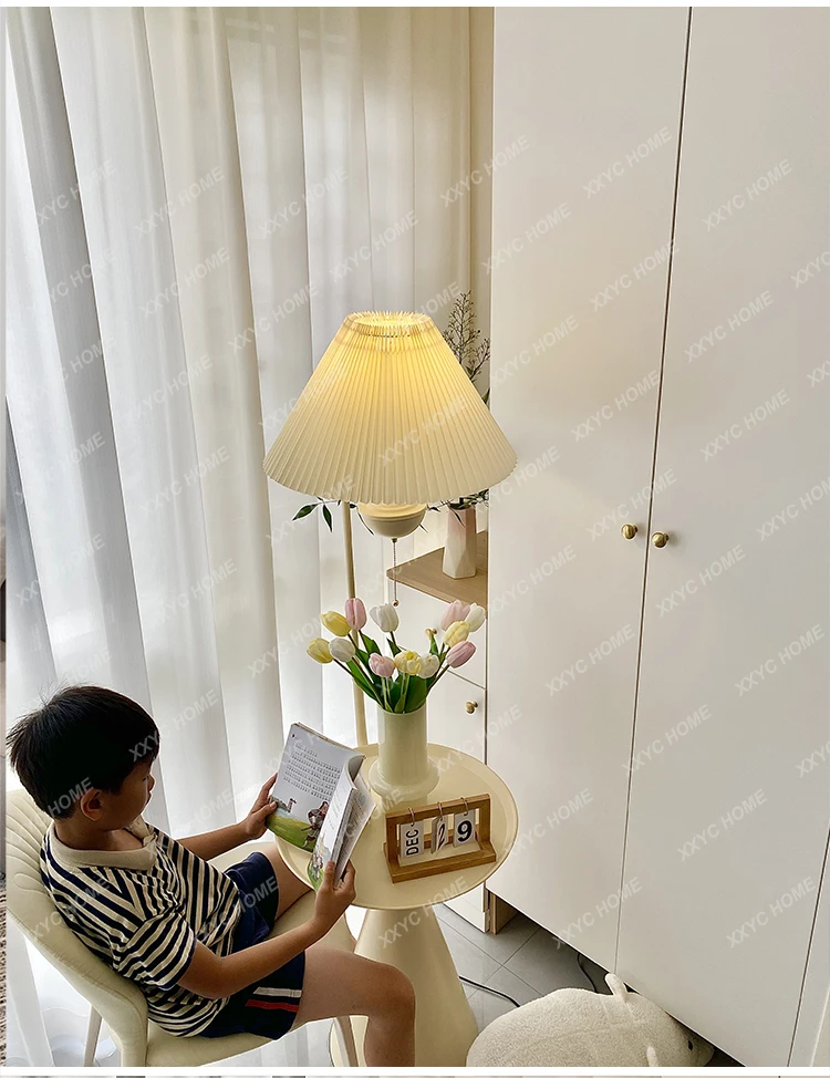 DF Cream wind living room sofa next to a few floor light sources integrated storage coffee table rack