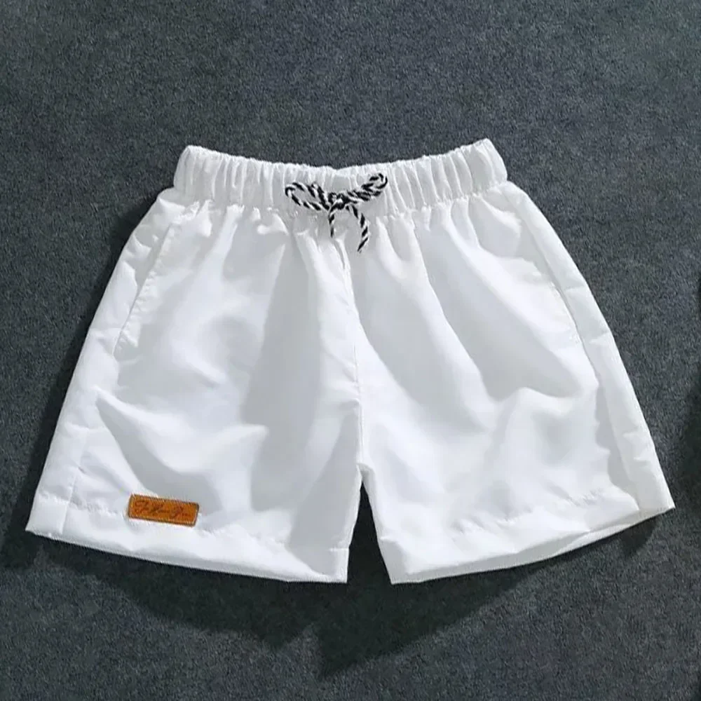 Shorts décontractés à la mode pour hommes, grande taille, demi-pantalon de sport de plage, fitness, cool, course à pied, pantalons d'été, joggeurs unis, nouveau