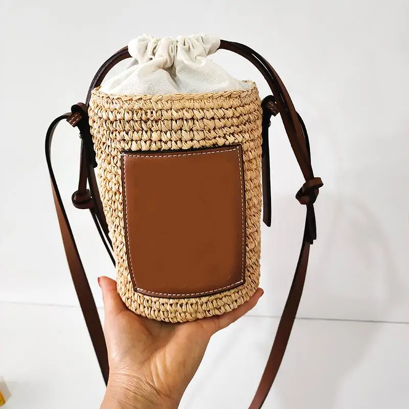 

2024 Summer New Women's Bucket Crossbody Bags Straw Woven Cylindrical Shoulder Bags Casual Handbags for Beach Holiday Seaside