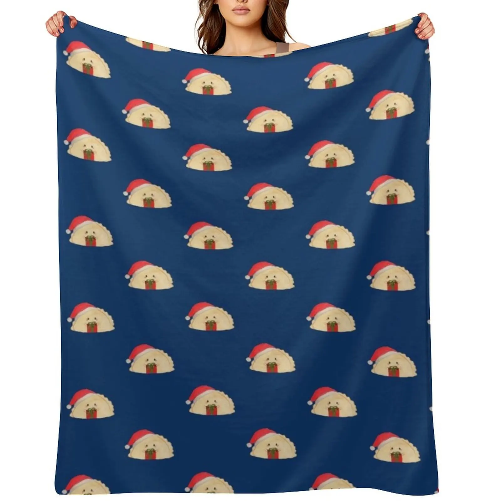 

Adorable cute Christmas pierogi dumplings in Santa hat holding a present on navy background Throw Blanket