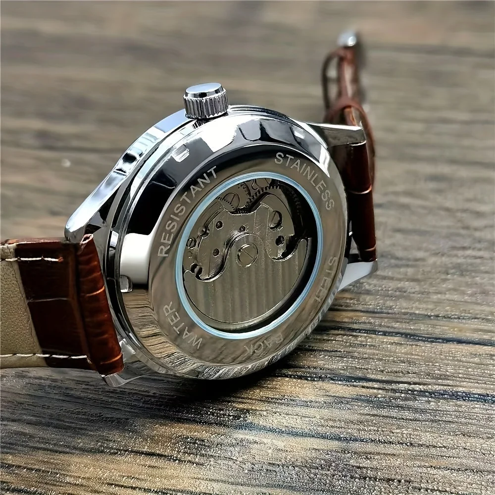 ساعة رجالية راقية بنمط عمل فاخر، تتميز بمينا هيكل عظمي، وهيكل معدني دائري، وحركة ميكانيكية أوتوماتيكية، وحزام جلدي، بدون بطارية، مثالية لعيد الحب، والكرنفال، وعيد الميلاد