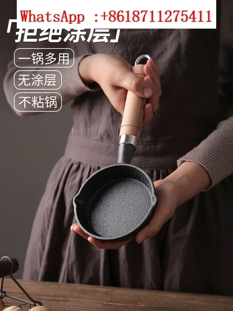 Cast iron frying pan with oil and hot oil, small pan for  eggs, special small  pan for frying eggs