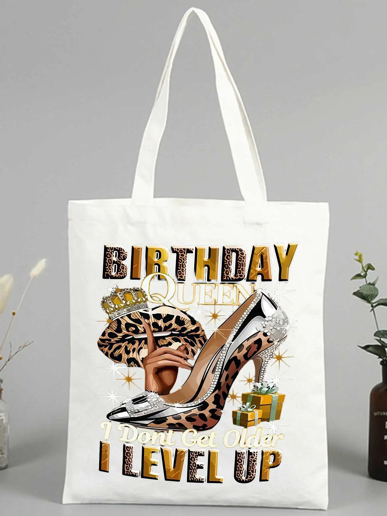 Women's canvas tote bag with high heel and crown graphic, ideal for birthday celebrations and casual outings