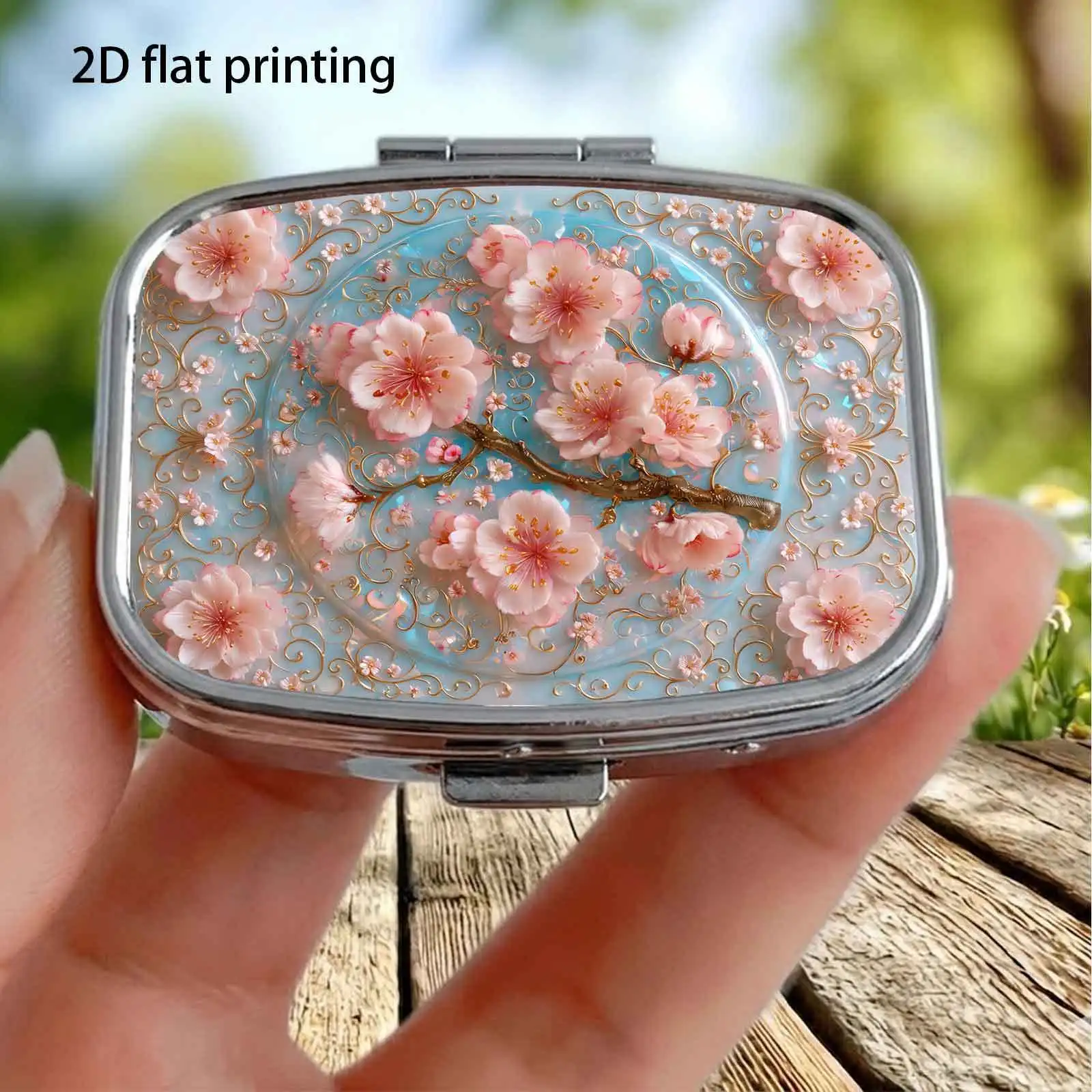 Light Blue Pearlescent Base with Embossed Pink Cherry Blossom Branches and Gentle Three-Dimensional Floral Pattern, Small Square Pill Organizer with Two Compartments, Portable Medicine Storage, Can Also Be Used as a Home Portable Organizer, Decorative Box, Perfect for Handbags, Wallets, and Travel, Metal Storage Box, Small Jewelry Organizer, Holiday Gifts, Souvenirs, Prizes, Small Gifts