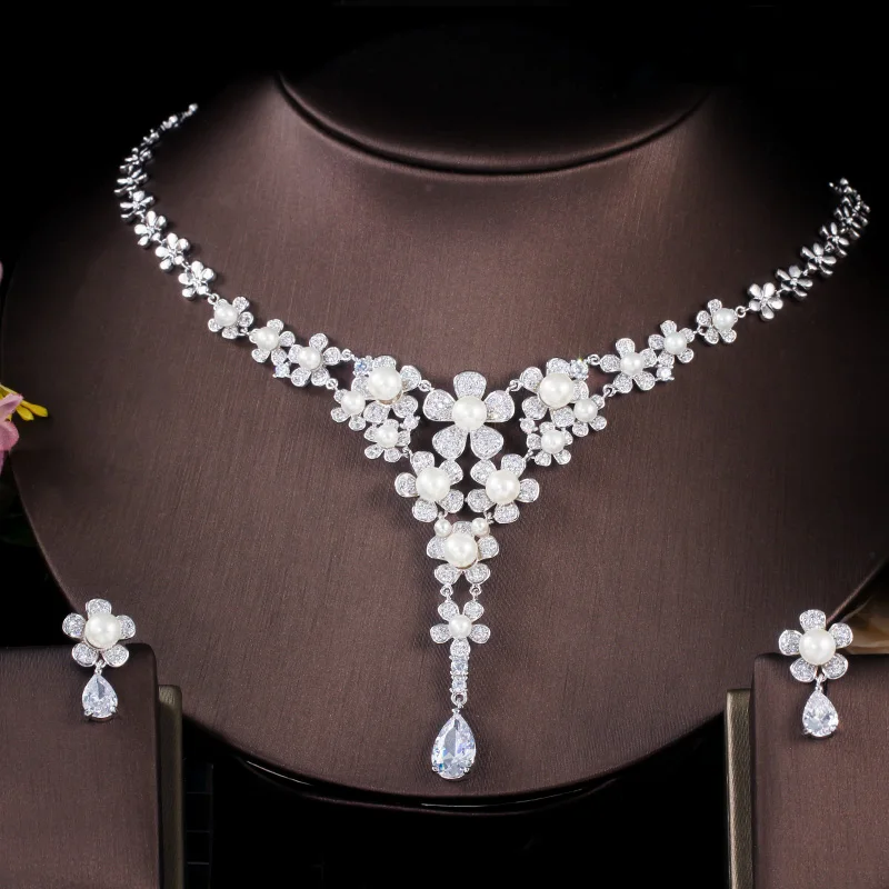 

ThreeGraces Chic Elegant Shiny Zirconia Long Flower Shape Simulated Pearl Necklace Earrings Bridal Jewelry Set for Brides JS619