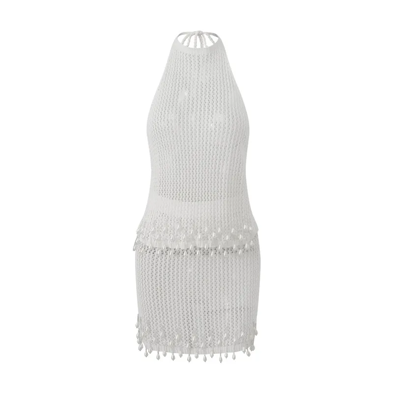 

Женский вязаный комплект из 2 предметов: стильный однотонный топ-халтер с вырезами и завязками на спине и мини-юбка для лета 2026