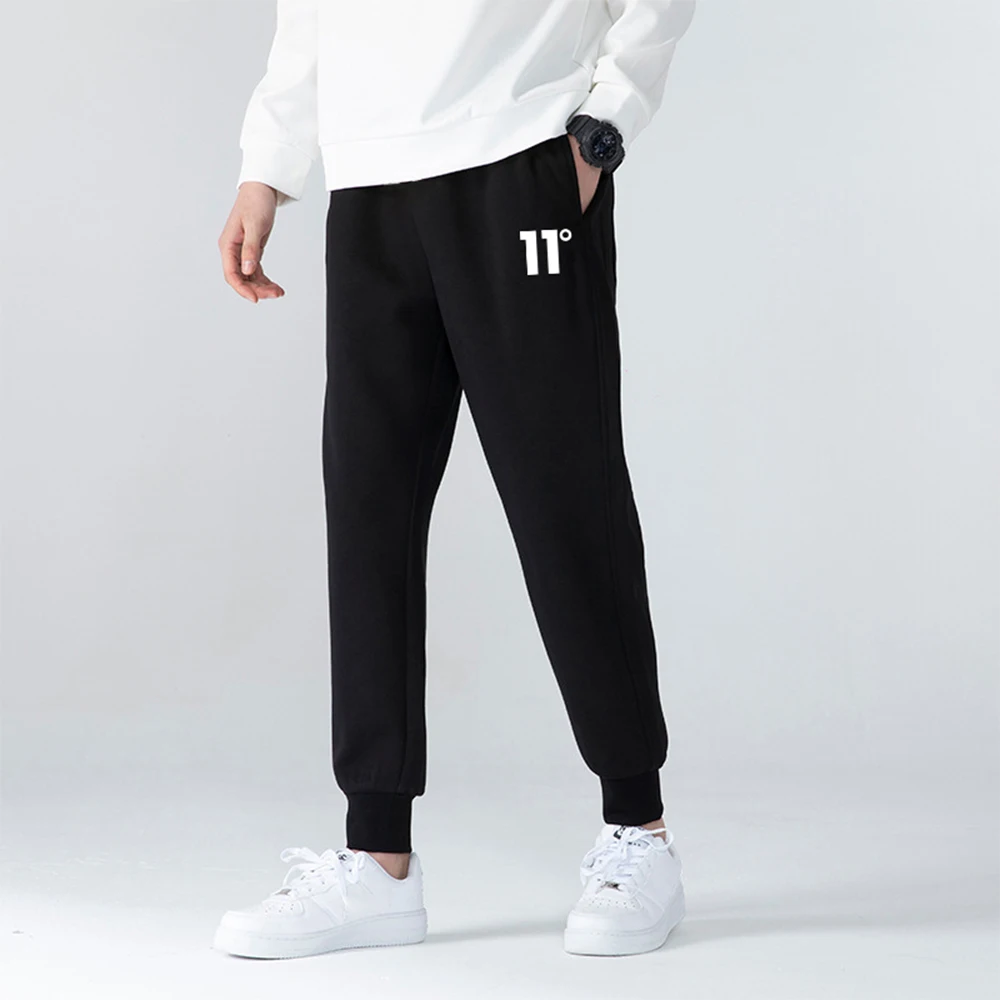

Newly designed printed men's long pants and sweatpants. Summer and autumn style sports pants. Fashionable laced casual men's spo