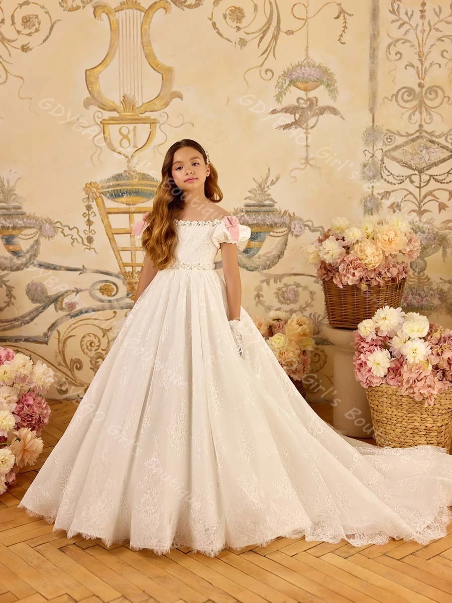 Ivoorkleurige kanten trouwjurk voor bloemenmeisjes Doorzichtige nekborstel Trein Optocht Communiejurk met strik Aangepaste feestjurk voor kinderen