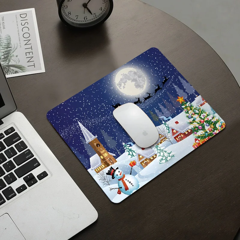 

The Christmas mouse pad snowman Santa Claus sleigh and Starry Night design anti-slip rubber base is suitable for home office use