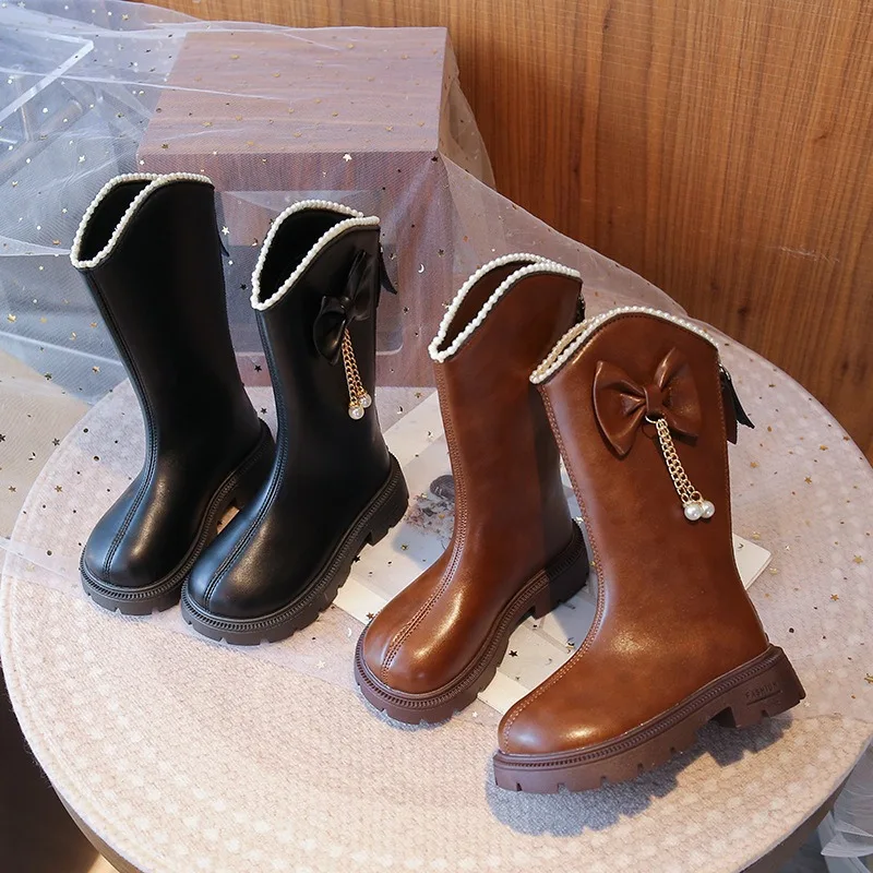 

Осенне-зимние новые сезонные ботинки из искусственной кожи для девочек. Детские модные высокие сапоги принцессы с круглым бантом. 2025 г. Модные ботинки для девочек.