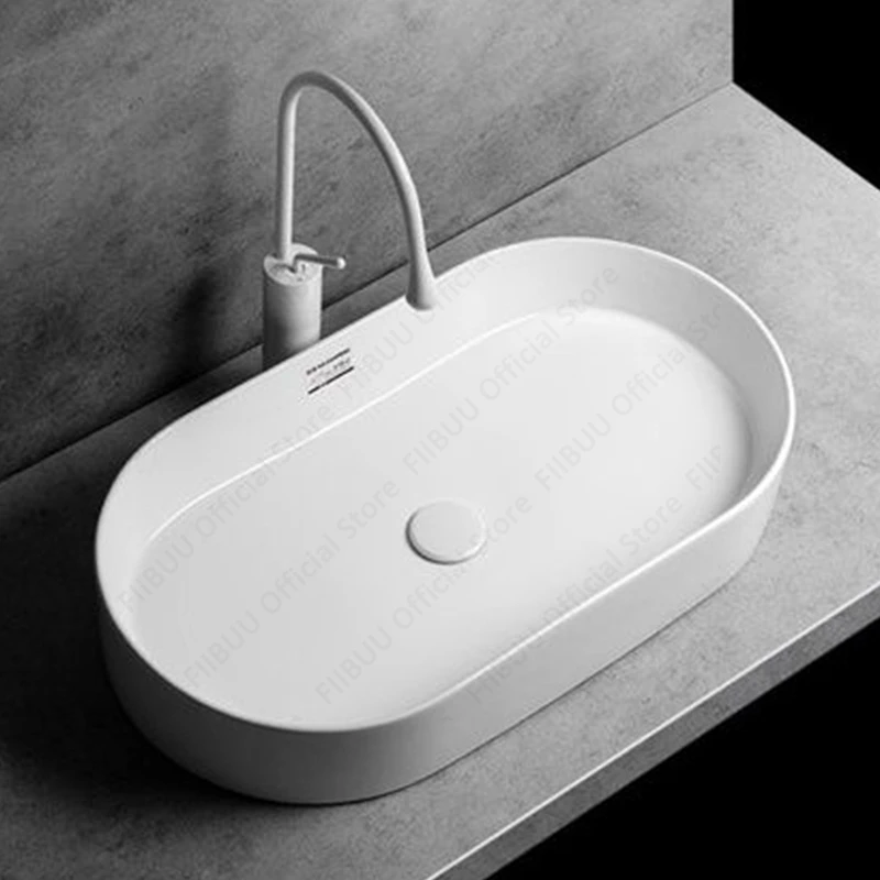 White Ceramic Above Counter Sink Modern Simple Oval Bathroom Sink Washroom and Balcony Artistic Wash Basin for Home Office Use