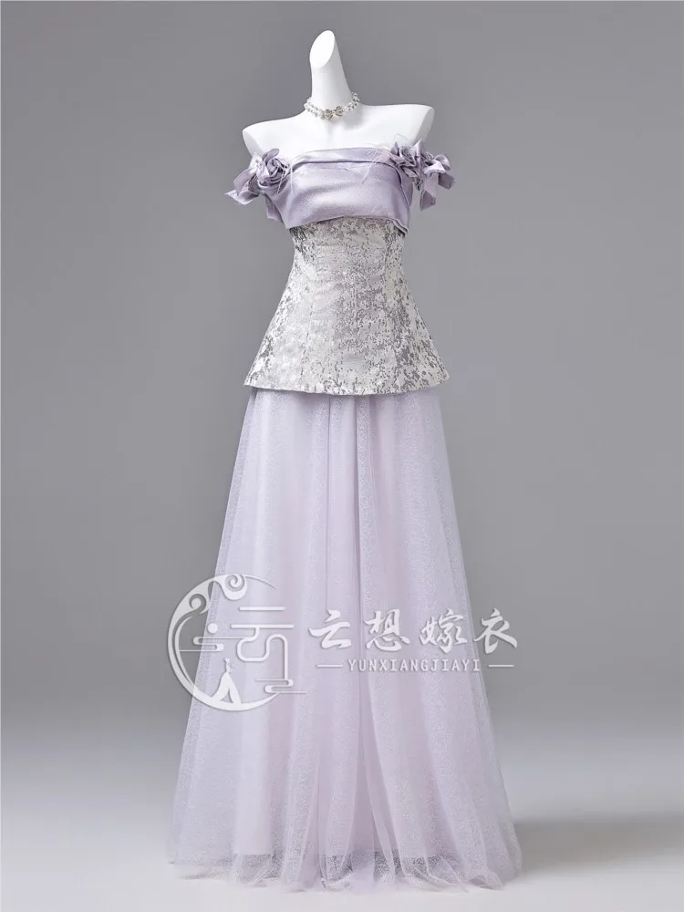 A long light purple dress with one-shoulder strapless design that exudes luxurious toasting vibe