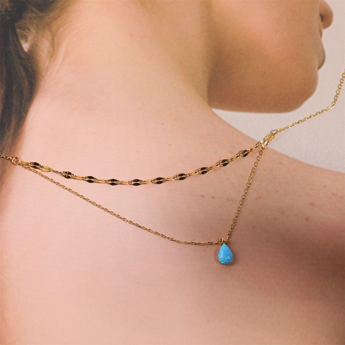 

Stainless steel blue tears small and delicate Aobao blue water droplet sparkling double-layer necklace plated with 18K gold