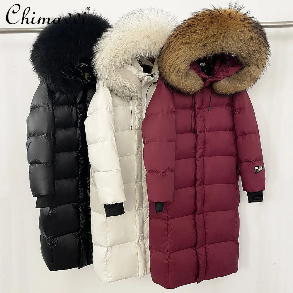 2025 الشتاء موضة أوزة طويلة أسفل سترة فو الفراء طوق مقنعين فضفاضة عادية سميكة الدافئة أسفل معاطف للنساء سترة منفوخة