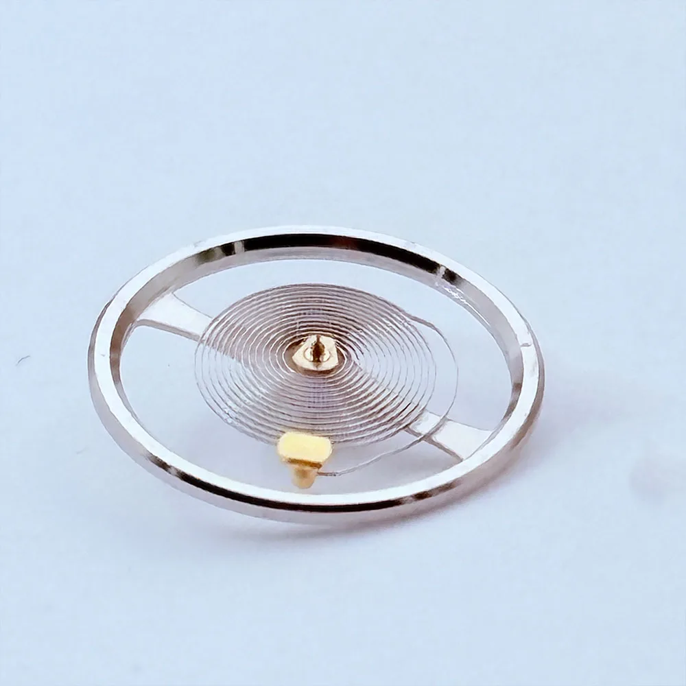 قطعة واحدة من ملحقات حركة الساعة المنتجة في الصين، عجلة توازن NH35 الجديدة، عجلة توازن NH36، عجلة توازن بيضاء مع رذاذ الشعر