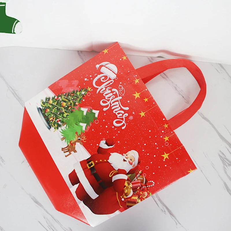 Borsa addensata tessuto Non tessuto stampato simpatico cartone animato babbo natale pupazzo di neve colore brillante robusto sacchetto di imballaggio impermeabile