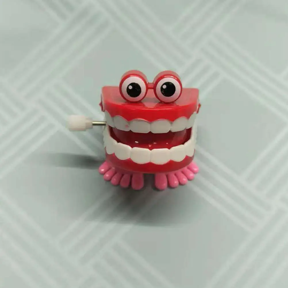 brinquedo-de-denticao-para-bebes-meninos-dente-saltitante-de-corda-com-movimento-de-relogio