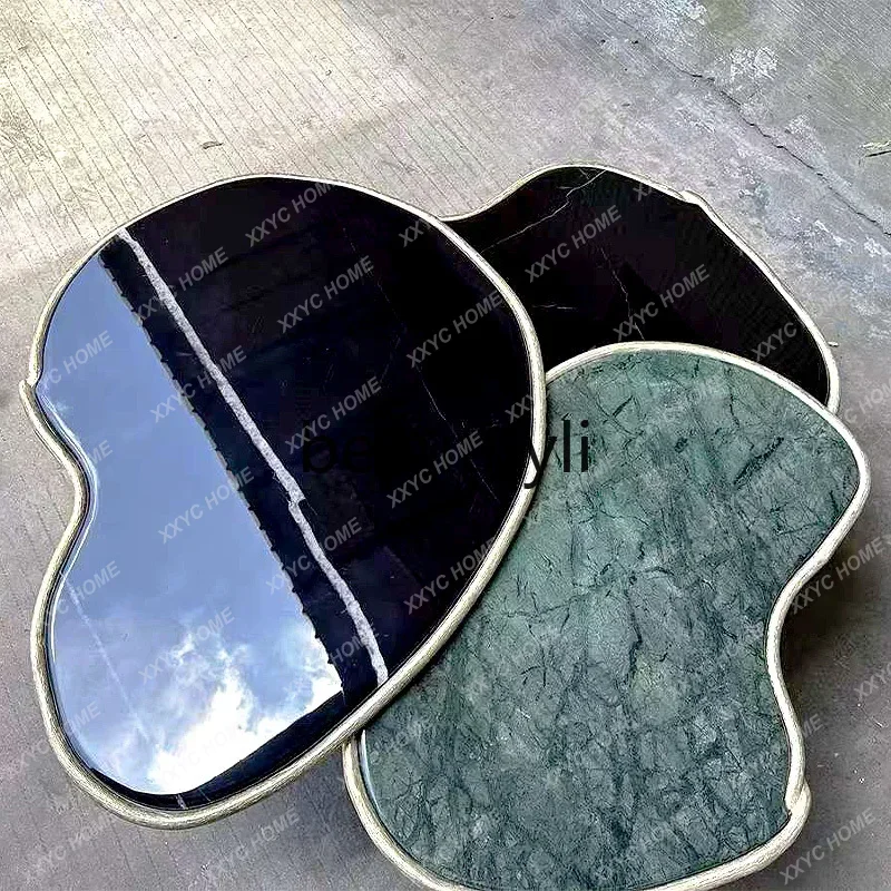 

A Italian marble coffee table light luxury high sense modern luxury special-shaped brass tea table