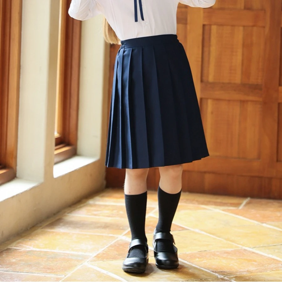 Adolescents enfants couleur unie taille haute jupe plissée filles uniforme scolaire JK jupe polyvalente enfants jupes mi-longues tenue décontracté