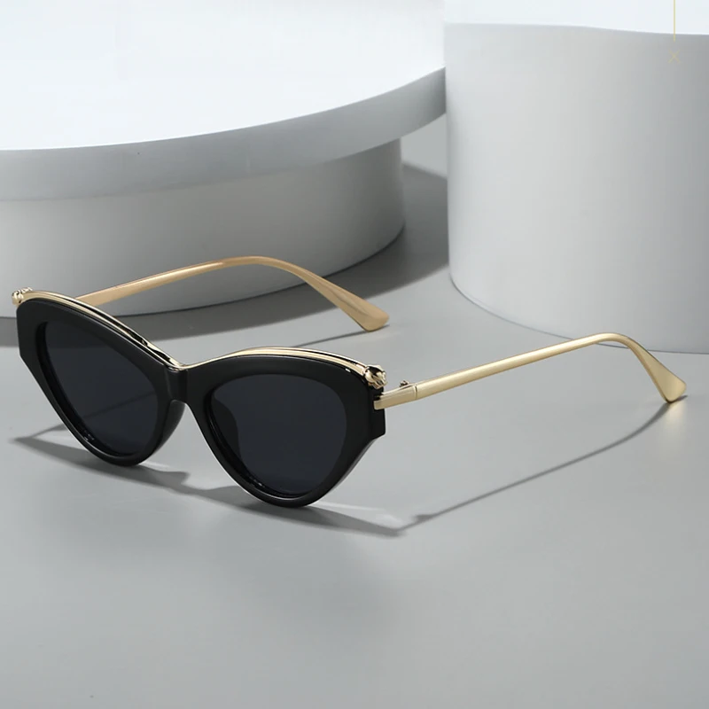 Lunettes de soleil élégantes œil de chat pour femme, monture métallique avec décoration guépard, branches argentées, style INS, protection UV400, idéales pour le shopping et les voyages