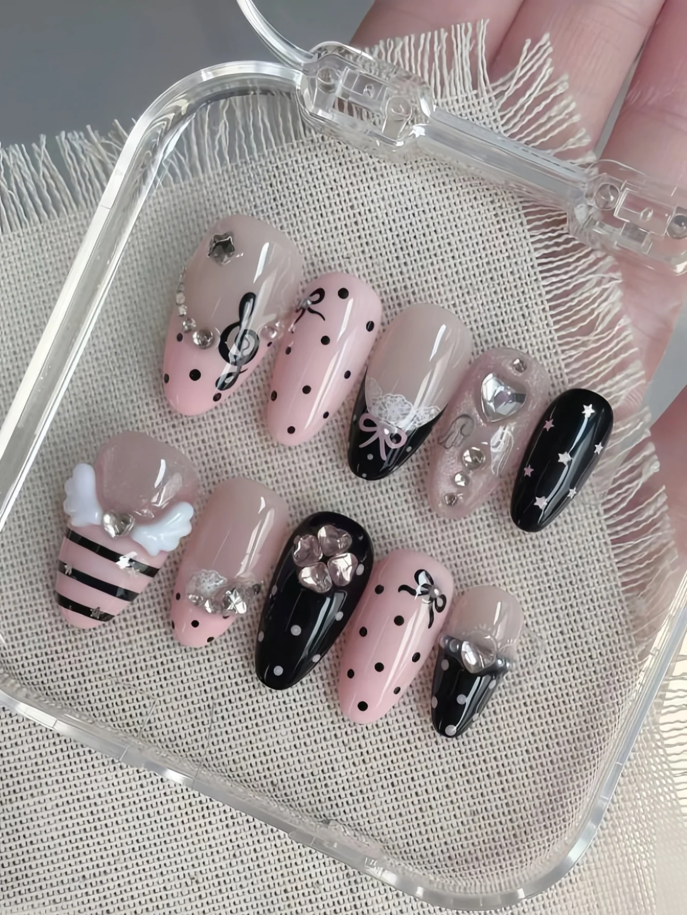 10-Piece Set of Pink and Black Musical Note Angel Wing Design, 3D Bow Lace Rhinestone False Nails, Medium Almond-Shaped Nail Tips