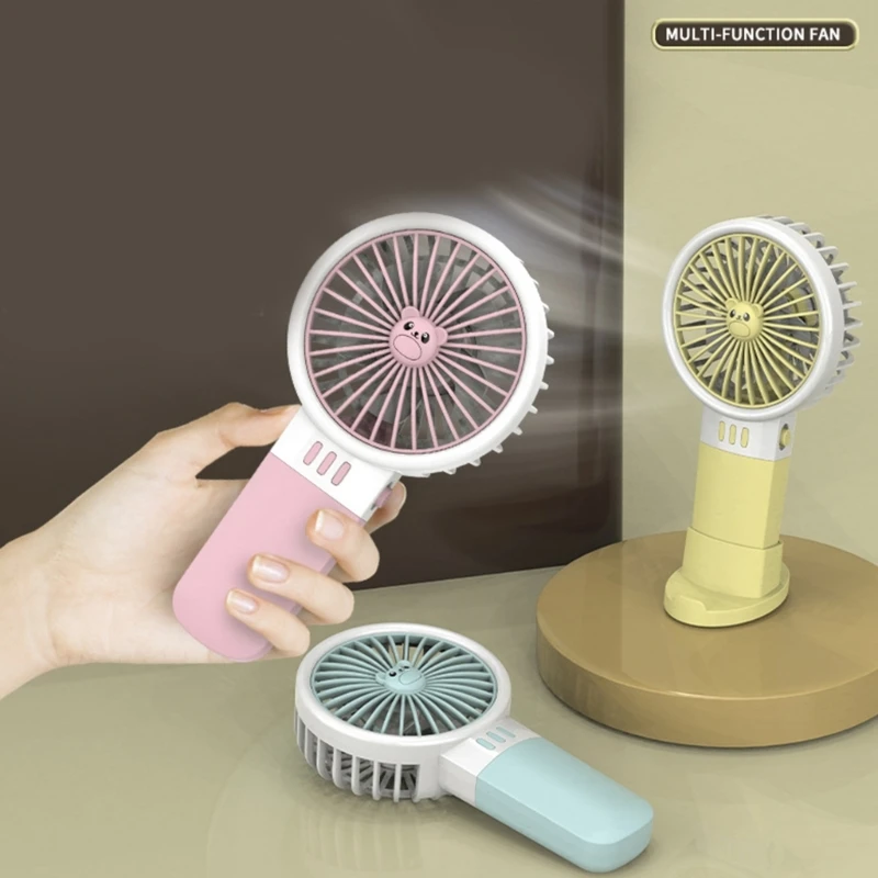 1PC Portable Mini Handheld Fan 2xAA Battery Operated(not included) for Office Home Travel Cooling Fan with phone Stand Holder