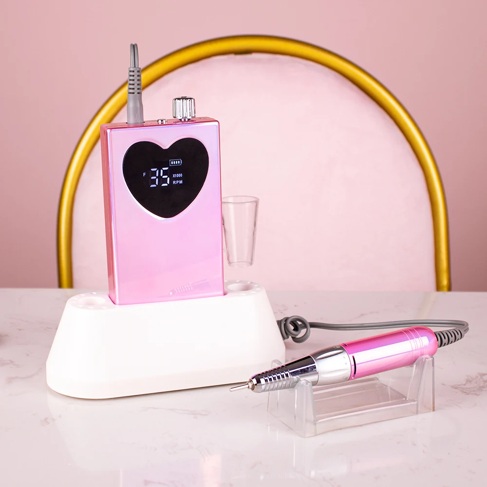 Metallic roze draadloze nagelboorvijlbasis met boren Oplaadbare lichtgewicht draagbare 35000 RPM nagelboormachine