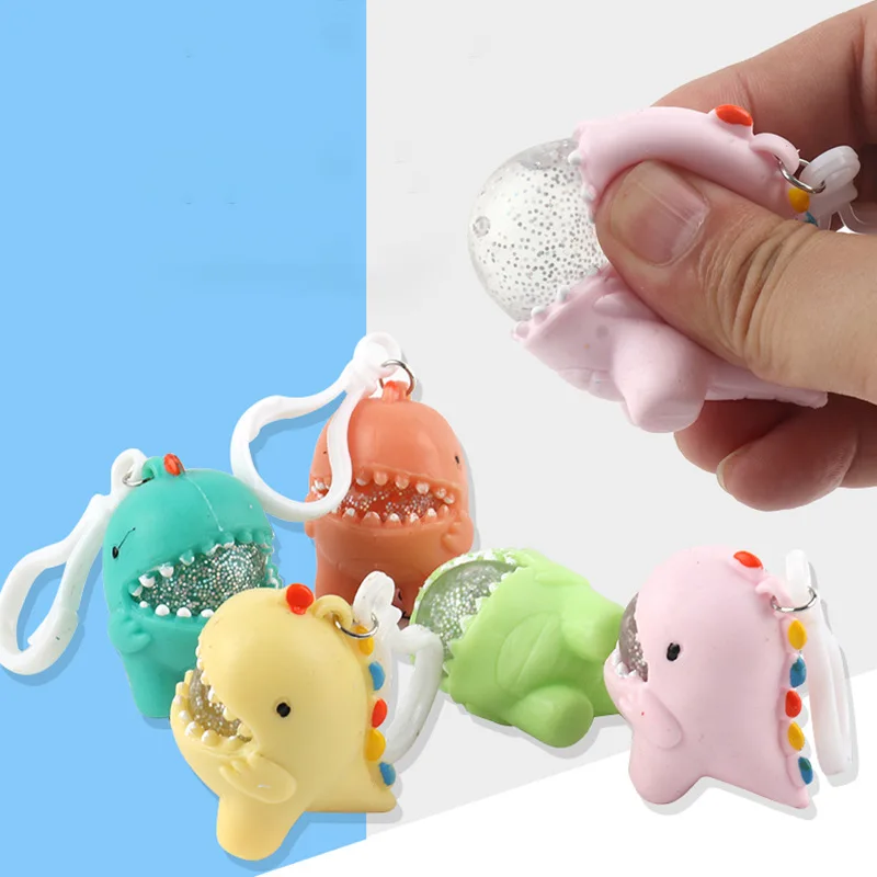 TPR cartoon dinosaur water polo pinch music cartoon soft rubber keychain vent ball to decompress children's toys